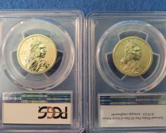 Lot 59. Two Special-Issue Sacagawea graded $1 coins