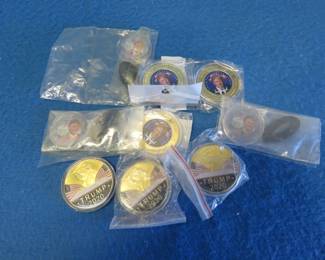 Lot 71. Six dollar-size and three half dollar-size gold-colored non-monetary Trump coins