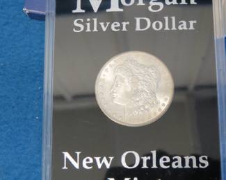 Lot 74. 1904 O high grade encased Morgan Silver Dollar
