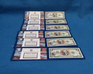 Lot 118. Five Grand Canyon and one Yellowstone colorized $2 bills