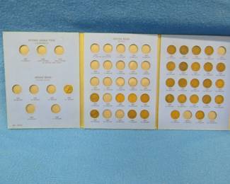 Lot 203. 29 Indian Head Pennies including 1858 in a Whitman album