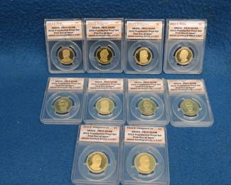 Lot 262. Ten "First Day of Issue" gold-colored Presidential Proof coins all slabbed and graded PR70 DCAM by ANACS.