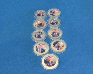 Lot 62. Nine colorized Donald J. Trump gold-colored, silver dollar-sized, non-monetary coins
