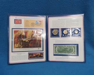 Lot 30. Declaration of Independence Commemoratives including a stamp panorama, 1976 dollar, half dollar and quarter coins, and a 1976 Bicentennial $2 bill