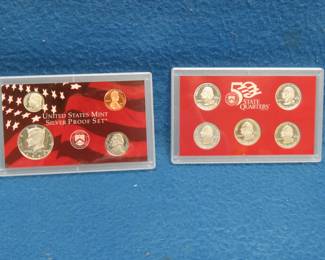 Lot 214. 1999 US Mint Silver Proof Set including 90% Silver Half, Dime, and Five State Quarters