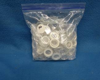 Lot 106. Large Ziploc bag full of coin capsules, mostly quarter and some half dollar sizes