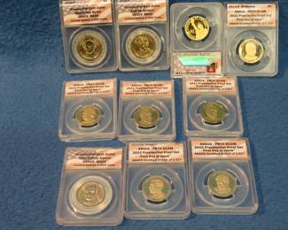 Lot 51. Ten slabbed gold-colored Presidential dollars all graded by ANACS