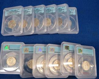 Lot 186. Twelve "First Day of Issue" satin finish District of Columbia and U.S. Territory Quarters slabbed by ANACS