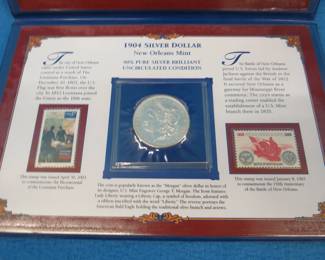 Lot 132. 1904 O Morgan Silver Dollar in a folder from the Postal Commemorative Society