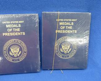 Lot 144. Two unopened U.S. Mint albums entitled "Medals of the Presidents"