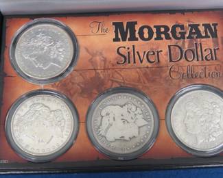Lot 152. Four Morgan Silver Dollars