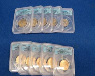 Lot 187. Eight "First Day of Issue" gold-colored 2009 D and P Presidential Quarters and two "First Day of Issue" 2009 P and D Sacagawea Quarters