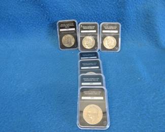 Lot 75. Seven encased Eisenhower dollar coins