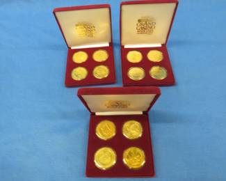 Lot 161. Three felt cases each with four Grand Casino coins