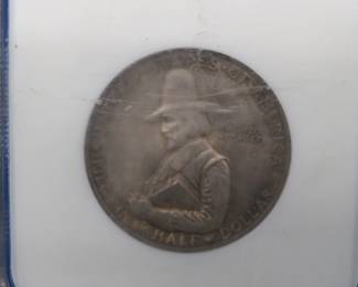 Lot 222. 1929 Pilgrim Tercentenary Half Dollar slabbed and graded MS 64 by NCG