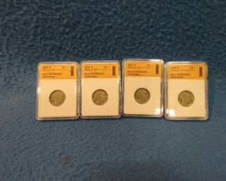 Lot 50. Four slabbed Buffalo Nickels certified by SGS dated 1920 P, 1921 P, 1929 P, and 1935 P.