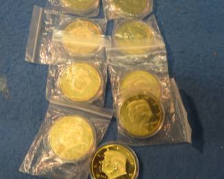 Lot 47. Nine encapsulated 2020 dollar-sized gold-clad non-monetary Donald Trump medallions