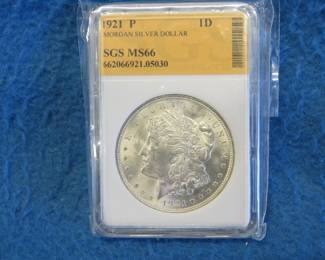 Lot 82. 1921 P SGS certified encased Morgan Silver Dollar