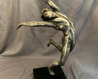 Silver Toned Metal Statue With Stand