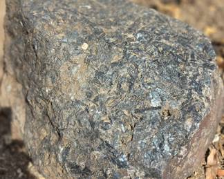 Large black quartz typ specimen boulder. There are many pieces like this,  all different varieties throughout the property, some boulders weighing a couple tons.