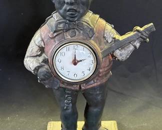 Lot # : 489z - Vintage cast iron banjo player clock
