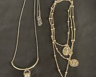 Lot # : 575v - 2 Gold tone religious and modern necklaces
