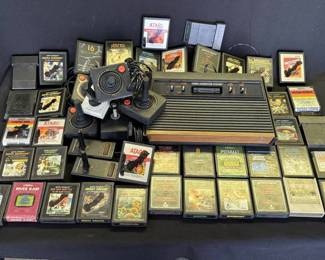 Lot # : 383z - Vintage Atari game system with controllers & games
