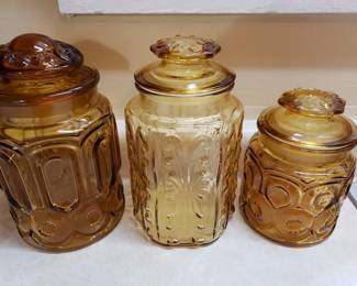 L E Smith amber canisters ('Atterbury Scroll' and 'Moon & Stars')