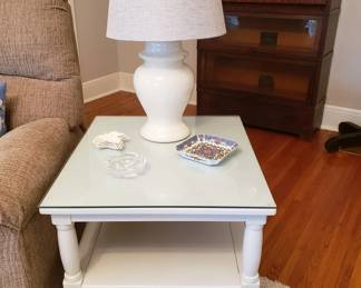 The second of two white end tables