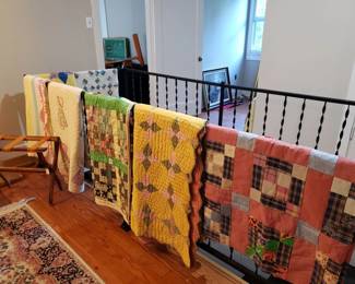 Assorted handmade quilts and quilt tops