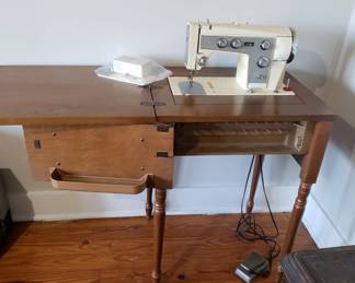 Sears Kenmore Model 90 sewing machine with cabinet