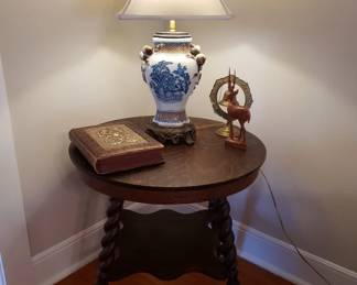 Quarter sawn oak table has tobacco twist and spool legs with ball (glass) and claw feet.