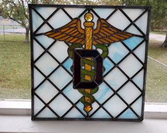 Stained glass doctor symbol