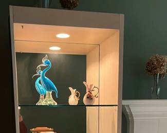 2 tall  mirrored display cabinet with lights (one shown in photo).   They are white but a beigy grayish white.  The size is 26 3/4 inches wide by 79 1/2 inches tall by 17 inches deep.