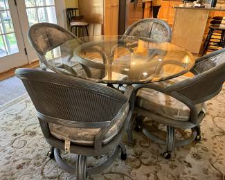 4 foot round kitchen table with glass top (the base is gray) + 4 chairs