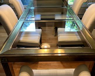 Iconic vintage brass dining table by Mastercraft.  Stunning brass table with leaf.  Beveled glass inserts, architectural brass details.  