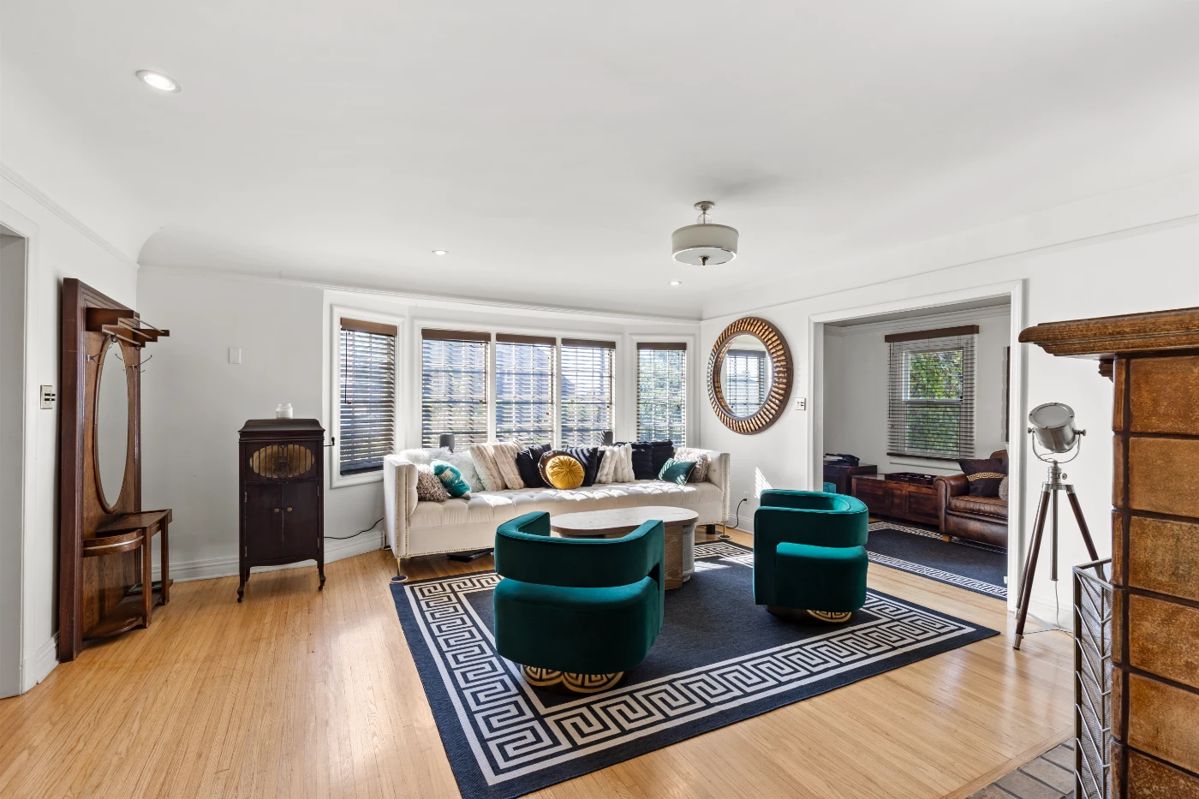 Record player, art deco hall tree with storage, 12 foot white velvet couch from Mod Shop, HD Buttercup mirror, hollywood spotlight, Crate and Barrel storage wood coffee table and matching side tables, standing desk, large oversized leather chair, bar decor, barware, gold, art deco pie holder storage unit, white and wood entry sideboard, large rugs, pillows, fireplace screen