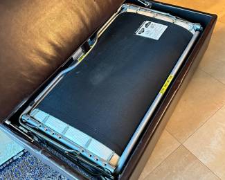 #44 - $100.00  -  Leather Ottoman hide-away rolling bed 16H x 46L x 28W
