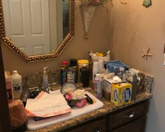 Bathroom items, towels, rugs, wall decor