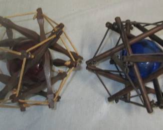 Glass orbs in wooden protectors 