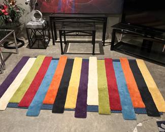 Colorful rug and large canvas picture.