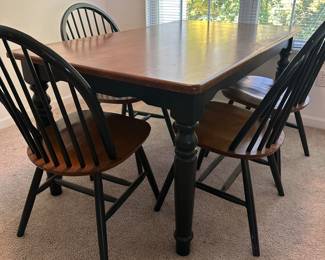 Lot 26 - $450 - Vintage Farmhouse table black base, maple top, measurements 36 x 60” with 4 Windsor chairs.  Legs are removable.  