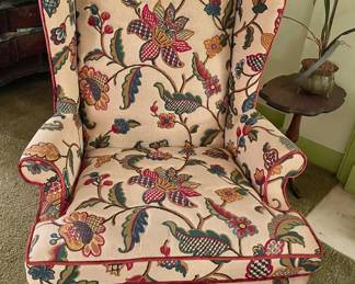 One of Two Floral Wing Back Chairs