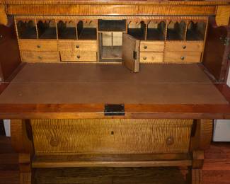A beautiful antique tiger maple 4 drawer drop front chest with hidden compartment 
