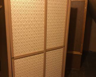 Vintage clothing storage closet, cardboard and wood