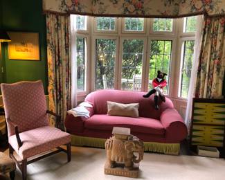 1 of 2 slip covered sofas, this one is a little sunned