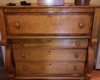 A beautiful antique tiger maple 4 drawer drop front chest with hidden compartment 