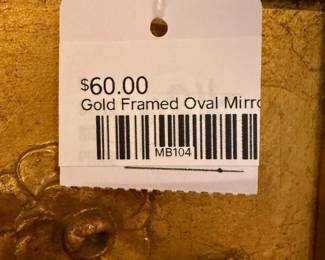 Gold framed oval mirror