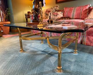 Brass and glass cocktail table, Striped sofa