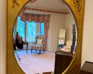 Gold framed oval mirror